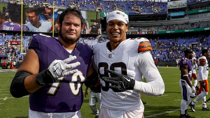 Former Huskies in Baltimore Ravens OT Roger Rosengarten and Cleveland Browns edge Joe Tryon-Shoyinka (90) share an NFL moment. Former Huskies in Baltimore Ravens OT Roger Rosengarten and Cleveland Browns edge Joe Tryon-Shoyinka (90) share an NFL moment.