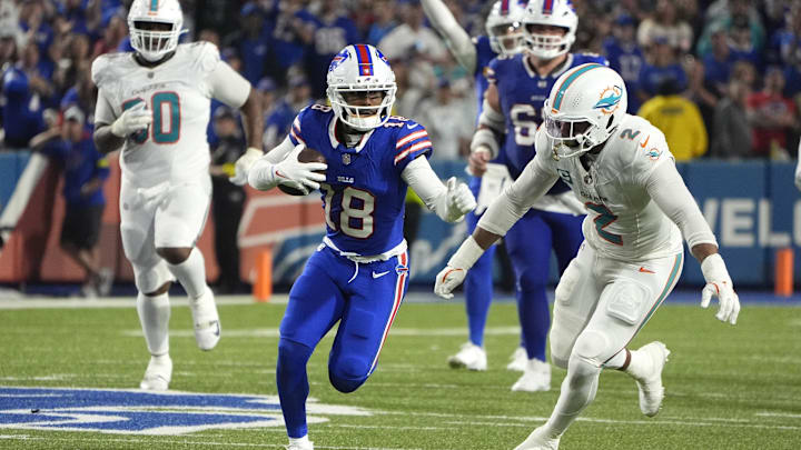 Buffalo Bills wide receiver Elijah Moore (18) runs against Miami Dolphins outside linebacker Bradley Chubb (2) in the fourth quarter at Highmark Stadium.