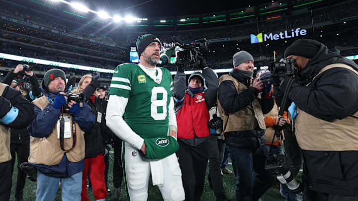 Jan 5, 2025; East Rutherford, New Jersey, USA; New York Jets quarterback Aaron Rodgers (8) walks on the field after the game against the Miami Dolphins at MetLife Stadium. Mandatory Credit: Vincent Carchietta-Imagn Images