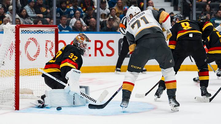 Vancouver Canucks goalie Kevin Lankinen (32) makes a save on Vegas Golden Knights' William Karlsson (71) in the third period at Rogers Arena. Mandatory Credit: Bob Frid-Imagn Images Vancouver Canucks goalie Kevin Lankinen (32) makes a save on Vegas Golden Knights' William Karlsson (71) in the third period at Rogers Arena. Mandatory Credit: Bob Frid-Imagn Images