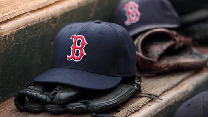 Aug 23, 2011; Arlington, TX, USA; Hats and gloves from the Boston Red Sox team near the edge of the dugout before the game against the Texas Rangers at Rangers Ballpark.  Mandatory Credit: Kevin Jairaj-Imagn Images