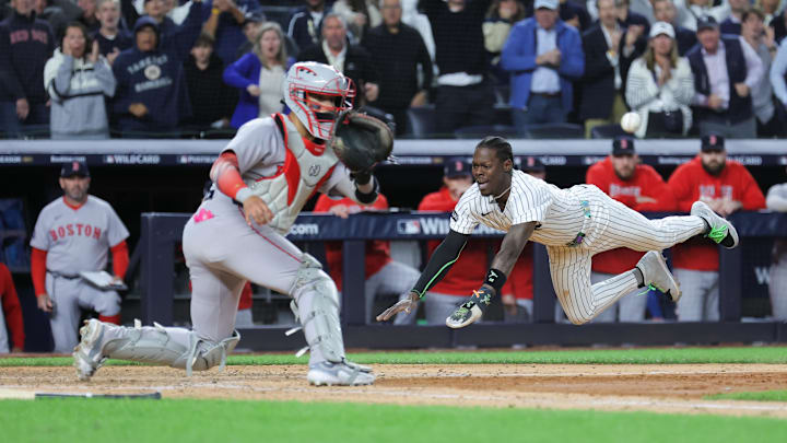 Oct 1, 2025; Bronx, New York, USA; New York Yankees second baseman Jazz Chisholm Jr. (13) slides into home to score on an hits an RBI single from New York Yankees catcher Austin Wells (28) (not pictured) during the eighth inning against the Boston Red Sox during game two of the Wildcard round for the 2025 MLB playoffs at Yankee Stadium. Mandatory Credit: Brad Penner-Imagn Images Oct 1, 2025; Bronx, New York, USA; New York Yankees second baseman Jazz Chisholm Jr. (13) slides into home to score on an hits an RBI single from New York Yankees catcher Austin Wells (28) (not pictured) during the eighth inning against the Boston Red Sox during game two of the Wildcard round for the 2025 MLB playoffs at Yankee Stadium. Mandatory Credit: Brad Penner-Imagn Images