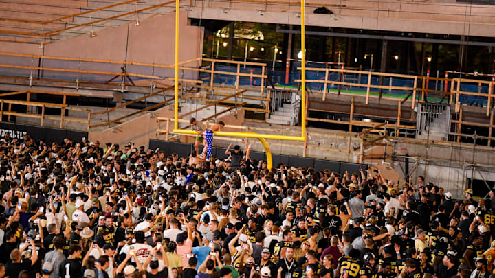 Oct 5, 2024; Nashville, Tennessee, USA; Vanderbilt Commodores fans tear down the goal post after a victory over the Alabama Crimson Tide at FirstBank Stadium. Mandatory Credit: Steve Roberts-Imagn Images Oct 5, 2024; Nashville, Tennessee, USA; Vanderbilt Commodores fans tear down the goal post after a victory over the Alabama Crimson Tide at FirstBank Stadium. Mandatory Credit: Steve Roberts-Imagn Images