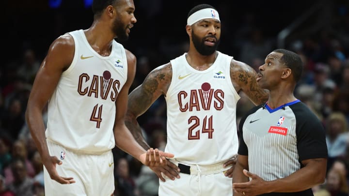 Mar 29, 2024; Cleveland, Ohio, USA; Cleveland Cavaliers forward Evan Mobley (4) and forward Marcus Morris Sr. (24) argue a call with referee Dedric Taylor (21) during the first half against the Philadelphia 76ers at Rocket Mortgage FieldHouse. Mandatory Credit: Ken Blaze-USA TODAY Sports