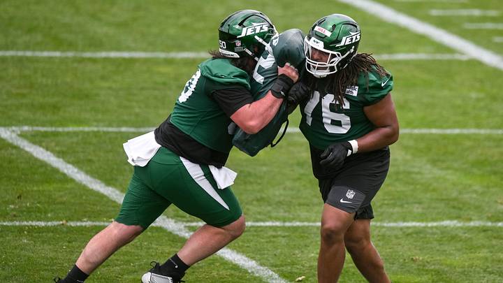 Jun 10, 2026; Florham Park, NY, USA; New York Jets guard Liam Fornadel (50) and offensive lineman Xavier Hill (76) participate in a drill during minicamp at Atlantic Health Jets Training Center. Mandatory Credit: John Jones-Imagn Images