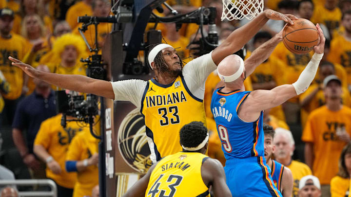 Jun 19, 2025; Indianapolis, Indiana, USA; Indiana Pacers center Myles Turner (33) blocks a shot by Oklahoma City Thunder guard Alex Caruso (9) in the third quarter during game six of the 2025 NBA Finals at Gainbridge Fieldhouse. Mandatory Credit: Kyle Terada-Imagn Images