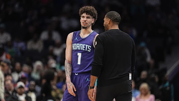 Charlotte Hornets guard LaMelo Ball (1) talks with head coach Charles Lee