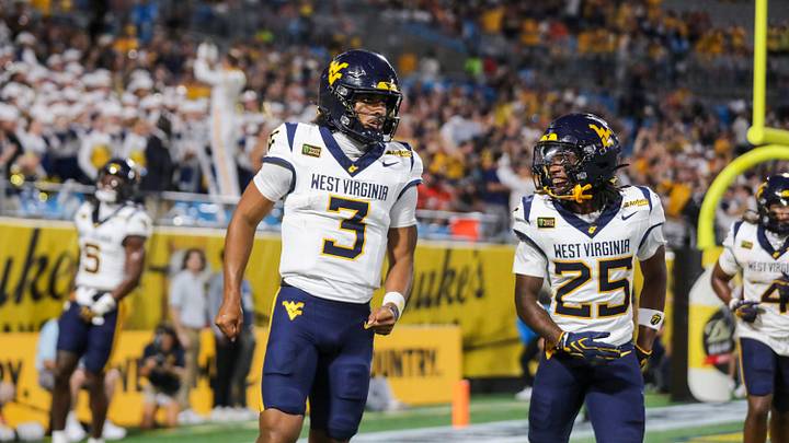 Sep 19, 2026; Charlotte, North Carolina, USA; West Virginia Mountaineers quarterback Michael Hawkins Jr. (3) celebreates with West Virginia Mountaineers wide receiver Armoni Weaver-Bomar (25) after a touchdown during the first quarter against the Virginia Cavaliers at Bank of America Stadium. Mandatory Credit: Ben Queen-Imagn Images Sep 19, 2026; Charlotte, North Carolina, USA; West Virginia Mountaineers quarterback Michael Hawkins Jr. (3) celebreates with West Virginia Mountaineers wide receiver Armoni Weaver-Bomar (25) after a touchdown during the first quarter against the Virginia Cavaliers at Bank of America Stadium. Mandatory Credit: Ben Queen-Imagn Images