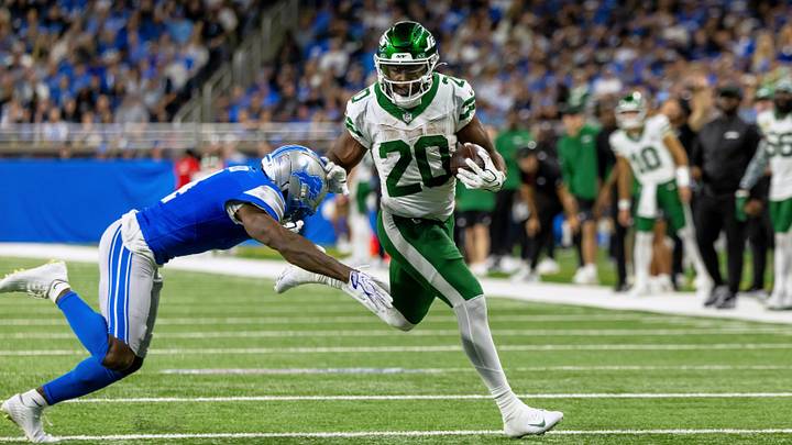 New York Jets running back Breece Hall (20) runs with the ball against Detroit Lions cornerback D.J. Reed (4) during the game at Ford Field. New York Jets running back Breece Hall (20) runs with the ball against Detroit Lions cornerback D.J. Reed (4) during the game at Ford Field.