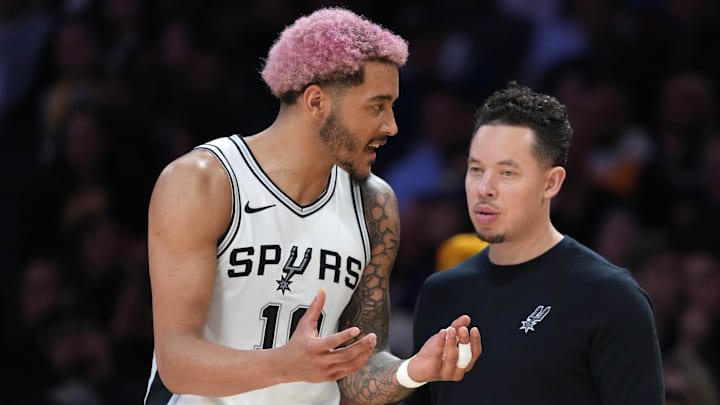 Mar 17, 2025; Los Angeles, California, USA; San Antonio Spurs assistant coach Mitch Johnson (right) talks with forward Jeremy Sochan (10) in the second half against the Los Angeles Lakers at Crypto.com Arena. Mandatory Credit: Kirby Lee-Imagn Images