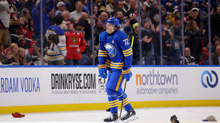 Mar 29, 2024; Buffalo, New York, USA;  Fans throw hats on the ice to celebrate a hatrick by Buffalo