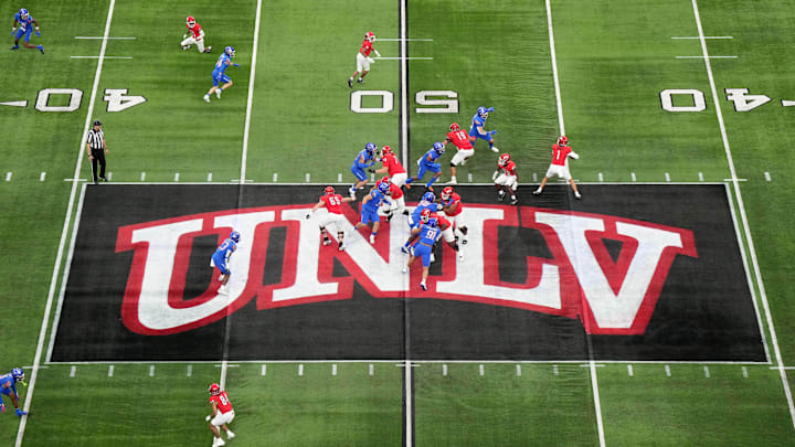 A general overall view as UNLV Rebels quarterback Jayden Maiava (1) throws the ball on the UNLV logo at midfield against the Boise State Broncos in the first half during the Mountain West Championship at Allegiant Stadium. Mandatory Credit: Kirby Lee-Imagn Images A general overall view as UNLV Rebels quarterback Jayden Maiava (1) throws the ball on the UNLV logo at midfield against the Boise State Broncos in the first half during the Mountain West Championship at Allegiant Stadium. Mandatory Credit: Kirby Lee-Imagn Images
