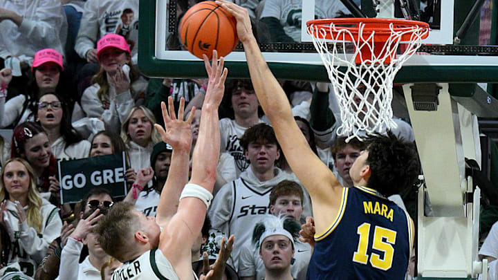 Jan 30, 2026; East Lansing, Michigan, USA;  Michigan Wolverines center Aday Mara (15) blocks a shot by Michigan State Spartans forward Jaxon Kohler (0) during the first half at Jack Breslin Student Events Center. Mandatory Credit: Dale Young-Imagn Images