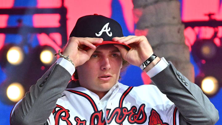 Jul 17, 2022; Los Angeles, CA, USA;  Former Atlanta Braves player Fred McGriff presents JR Ritchie right with his jersey after he was selected by the Atlanta Braves as the 35th pick of the MLB draft at XBox Plaza at LA Live. Mandatory Credit: Jayne Kamin-Oncea-Imagn Images