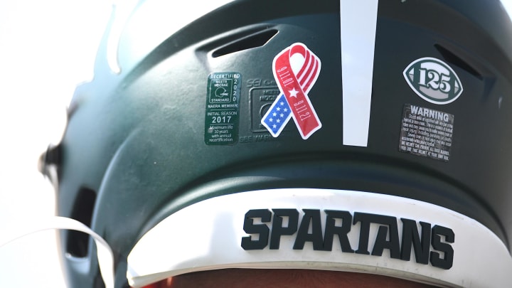 Sep 11, 2021; East Lansing, Michigan, USA; A detail view of a Michigan State Spartans helmet before the game against the Youngstown State Penguins at Spartan Stadium. Mandatory Credit: Tim Fuller-USA TODAY Sports