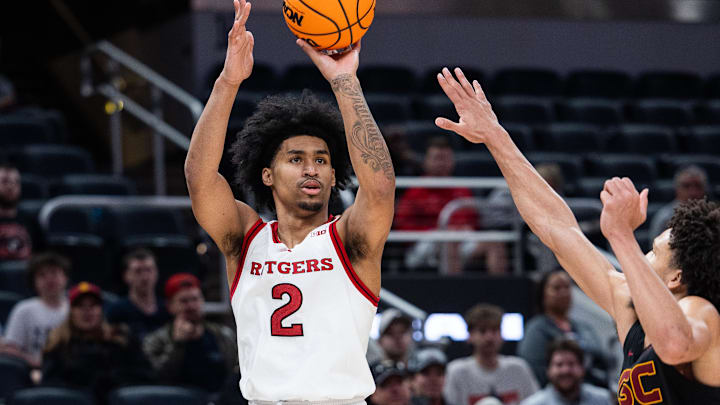 Mar 12, 2025; Indianapolis, IN, USA; Rutgers Scarlet Knights guard Dylan Harper (2) shoots the ball while USC Trojans guard Desmond Claude (1) defends in the second half at Gainbridge Fieldhouse. Mandatory Credit: Trevor Ruszkowski-Imagn Images