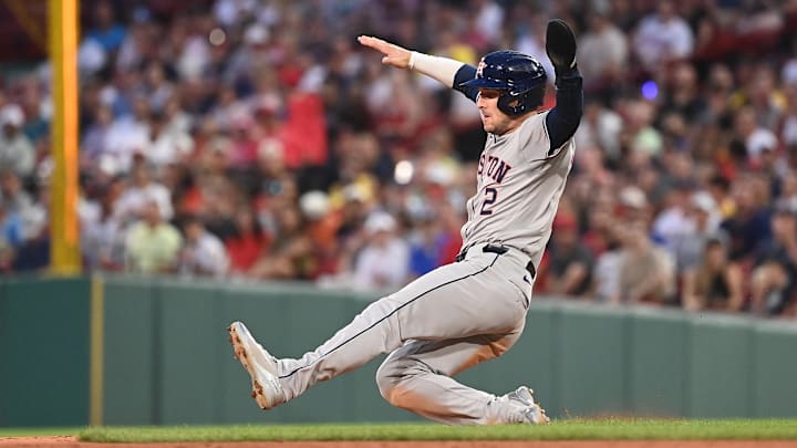 Aug 9, 2024; Boston, Massachusetts, USA; Houston Astros third baseman Alex Bregman (2) slides into second base during the third inning against the Boston Red Sox at Fenway Park.