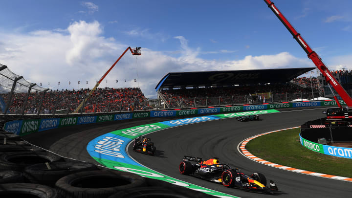 Max Verstappen of the Netherlands driving the (1) Oracle Red Bull Racing RB18 leads Sergio Perez of Mexico driving the (11) Oracle Red Bull Racing RB18 during the F1 Grand Prix of The Netherlands at Circuit Zandvoort on August 27, 2023 in Zandvoort, Netherlands. (Photo by Peter Fox/Getty Images) 