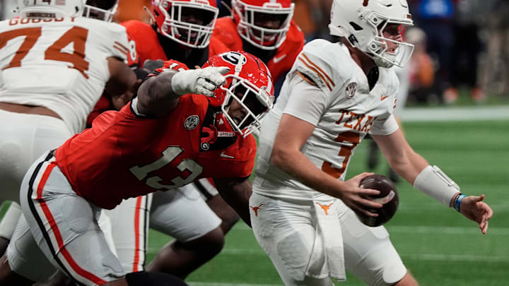 Georgia defensive lineman Mykel Williams (13) goes in for a sack on Texas quarterback Quinn Ewers (3) during the second half of the SEC championship game against Texas in Atlanta, on Saturday, Dec. 7, 2024.