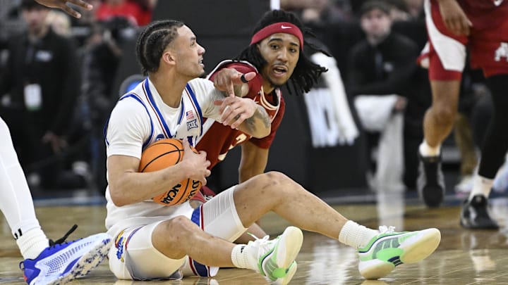 Mar 20, 2025; Providence, RI, USA;  Kansas Jayhawks guard Zeke Mayo (5) holds the ball against Arkansas Razorbacks during the second half at Amica Mutual Pavilion. Mandatory Credit: Eric Canha-Imagn Images