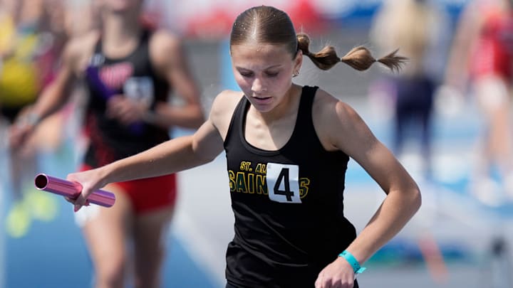 Council Bluff St. Albert’s Lili Denton finishes 1A girls 1600-meter distance medley in the Iowa High School co-ed state Track and field second Day at Drake Stadium on May 23, 2025, in Des Moines, Iowa.