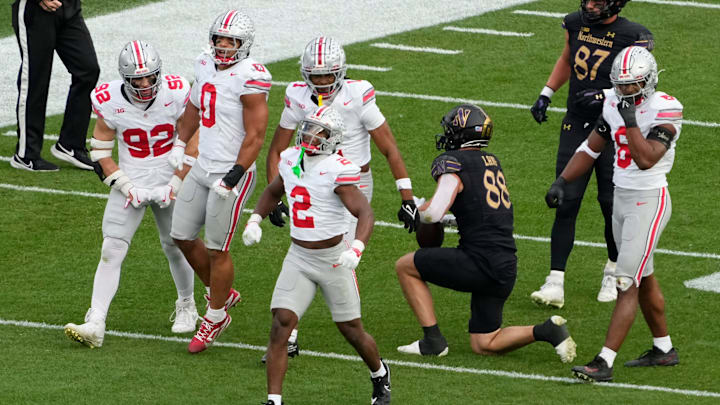 Ohio State Buckeyes safety Caleb Downs (2) celebrates a tackle of Northwestern Wildcats tight end Marshall Lang (88) during the second half of the NCAA football game at Wrigley Field in Chicago on Saturday, Nov. 16, 2024. Ohio State won 31-7. Ohio State Buckeyes safety Caleb Downs (2) celebrates a tackle of Northwestern Wildcats tight end Marshall Lang (88) during the second half of the NCAA football game at Wrigley Field in Chicago on Saturday, Nov. 16, 2024. Ohio State won 31-7.