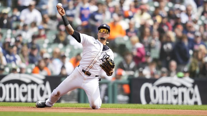 Apr 20, 2025; Detroit, Michigan, USA; Detroit Tigers third baseman Javier Baez (28) fields and throws out Kansas City Royals first baseman Salvador Perez (13) in the first inning at Comerica Park. Mandatory Credit: Aaron Doster-Imagn Images