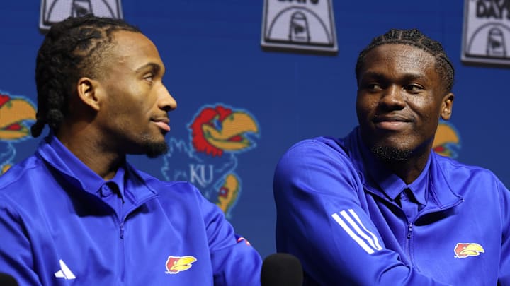 Oct 22, 2025; Kansas City, MO, USA; Kansas guard Darryn Peterson and forward Flory Bidunga react during Big 12 Menís Basketball media day at T-Mobile Center. Mandatory Credit: Sophia Scheller-Imagn Images