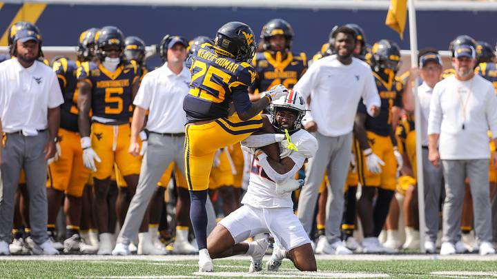 Sep 12, 2026; Morgantown, West Virginia, USA; UT Martin Skyhawks defensive back Quincy Hamilton (22) tackles West Virginia Mountaineers wide receiver Armoni Weaver-Bomar (25) during the first quarter at Milan Puskar Stadium. Mandatory Credit: Ben Queen-Imagn Images Sep 12, 2026; Morgantown, West Virginia, USA; UT Martin Skyhawks defensive back Quincy Hamilton (22) tackles West Virginia Mountaineers wide receiver Armoni Weaver-Bomar (25) during the first quarter at Milan Puskar Stadium. Mandatory Credit: Ben Queen-Imagn Images