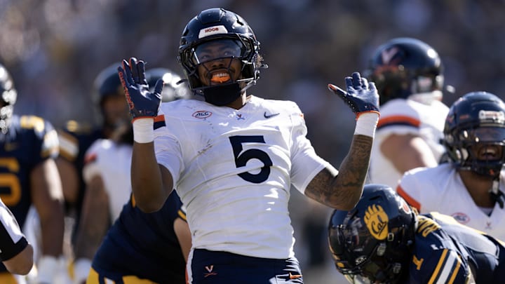 Nov 1, 2025; Berkeley, California, USA; Virginia Cavaliers linebacker Kam Robinson (5) reacts after sacking California Golden Bears quarterback Jaron-Keawe Sagapolutele (not pictured) during the second quarter at California Memorial Stadium. Mandatory Credit: D. Ross Cameron-Imagn Images