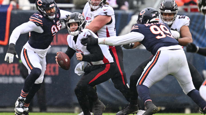  Falcons QB Taylor Heinicke is cornered by Bears defensive tackle Gervon Dexter Sr. for a sack.
