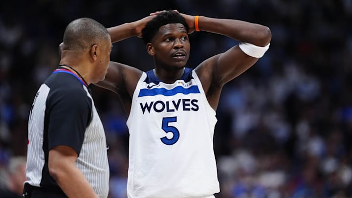 Apr 20, 2026; Denver, Colorado, USA; Minnesota Timberwolves guard Anthony Edwards (5) next to referee Tony Brothers (25) in the second half against the Denver Nuggets during game two of the first round of the 2026 NBA Playoffs at Ball Arena. Mandatory Credit: Ron Chenoy-Imagn Images