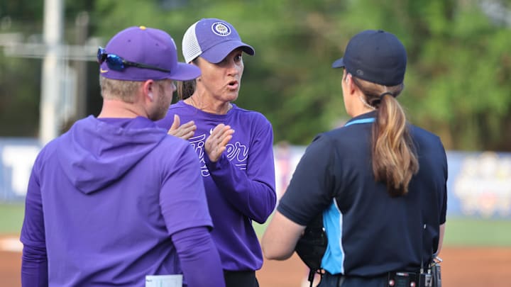 May 9, 2024; Auburn, AL, USA;  LSU head coach Beth Torina talks with a game official during the quarterfinals of the SEC Softball Championship at Jane B. Moore Field. Mandatory Credit: John Reed-Imagn Images