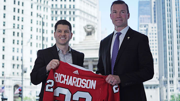Jun 29, 2022; Chicago, IL, USA; Chicago Blackhawks new head coach Luke Richardson (right) and Hawks general manager Kyle Davidson, (left) pose for photos at a press conference at the Chicago Blackhawks Store. Mandatory Credit: David Banks-Imagn Images