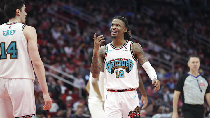 Jan 13, 2025; Houston, Texas, USA; Memphis Grizzlies guard Ja Morant (12) reacts after a play during the second half against the Houston Rockets at Toyota Center. Mandatory Credit: Troy Taormina-Imagn Images