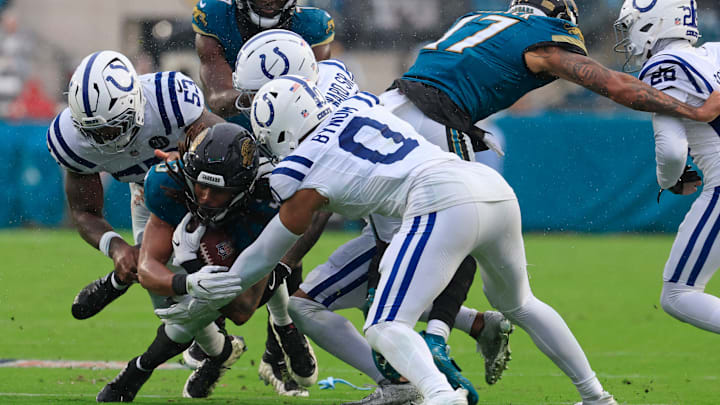 Jacksonville Jaguars wide receiver Jakobi Meyers (3) is tackled by Indianapolis Colts linebacker Germaine Pratt (53), cornerback Charvarius Ward (7) and safety Cam Bynum (0) during the fourth quarter of an NFL football game at EverBank Stadium, Sunday, Dec. 7, 2025, in Jacksonville, Fla. The Jaguars defeated the Colts 36-19.