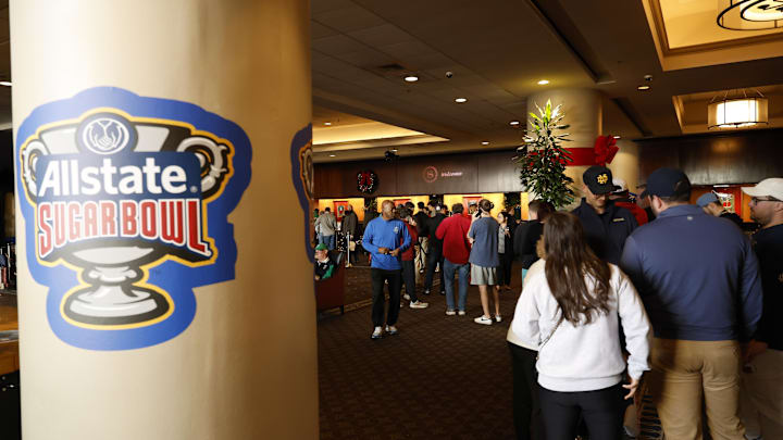Jan 1, 2025; New Orleans, LA, USA; Fans line at the front desk of the Sheraton hotel after the Sugar Bowl CFP quarterfinal between Georgia and Notre Dame was postponed after an attack on Bourbon Street. Jan 1, 2025; New Orleans, LA, USA; Fans line at the front desk of the Sheraton hotel after the Sugar Bowl CFP quarterfinal between Georgia and Notre Dame was postponed after an attack on Bourbon Street.