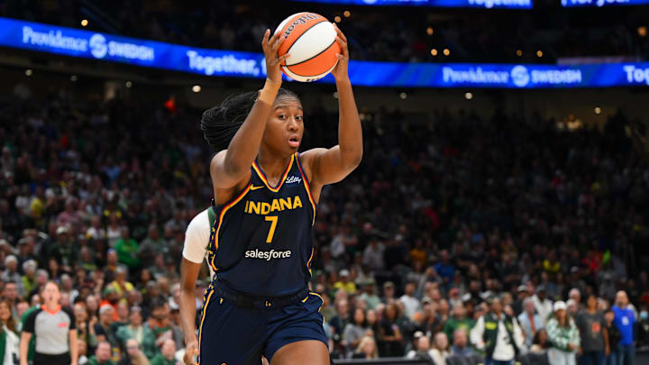 Aug 3, 2025; Seattle, Washington, USA; Indiana Fever forward Aliyah Boston (7) rebounds the ball against the Seattle Storm during the second half at Climate Pledge Arena. Mandatory Credit: Steven Bisig-Imagn Images
