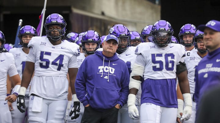 Oct 25, 2025; Morgantown, West Virginia, USA; Texas Christian University Horned Frogs head coach Sonny Dykes leads his team onto the field prior to their game against the West Virginia Mountaineers at Milan Puskar Stadium. Mandatory Credit: Ben Queen-Imagn Images