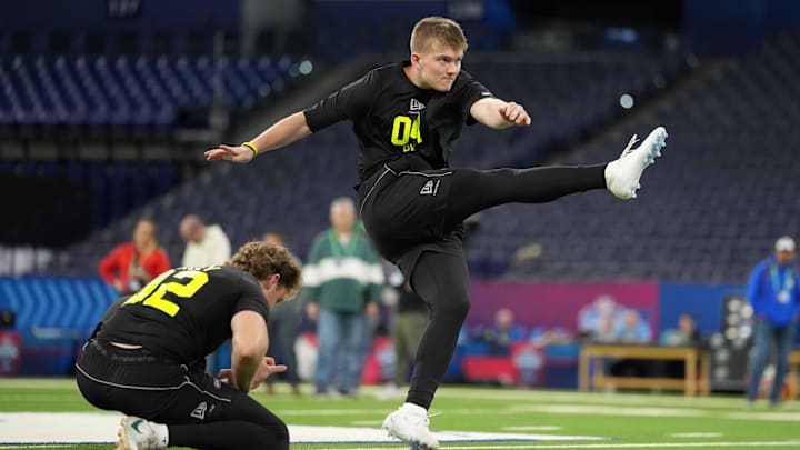 Feb 25, 2026; Indianapolis, IN, USA; Iowa place kicker Drew Stevens (PK04) kicks the ball out of the hold of Ryan Eckley of Michigan State during the NFL Scouting Combine at Lucas Oil Stadium. Mandatory Credit: Kirby Lee-Imagn Images Feb 25, 2026; Indianapolis, IN, USA; Iowa place kicker Drew Stevens (PK04) kicks the ball out of the hold of Ryan Eckley of Michigan State during the NFL Scouting Combine at Lucas Oil Stadium. Mandatory Credit: Kirby Lee-Imagn Images