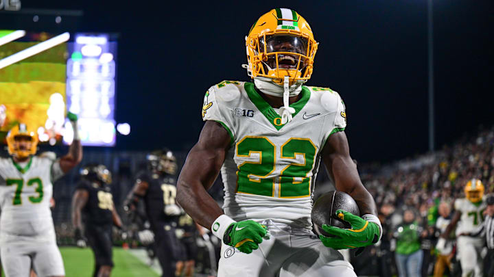 Oct 18, 2024; West Lafayette, Indiana, USA; Oregon Ducks running back Jay Harris (22) celebrates scoring a touchdown during the second half against the Purdue Boilermakers at Ross-Ade Stadium. Oct 18, 2024; West Lafayette, Indiana, USA; Oregon Ducks running back Jay Harris (22) celebrates scoring a touchdown during the second half against the Purdue Boilermakers at Ross-Ade Stadium.
