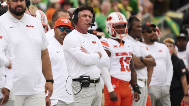 Eugene, Oregon, USA; Oklahoma State Cowboys head coach Mike Gundy looks up from the sidelines during the first half in a game against the Oregon Ducks at Autzen Stadium.
