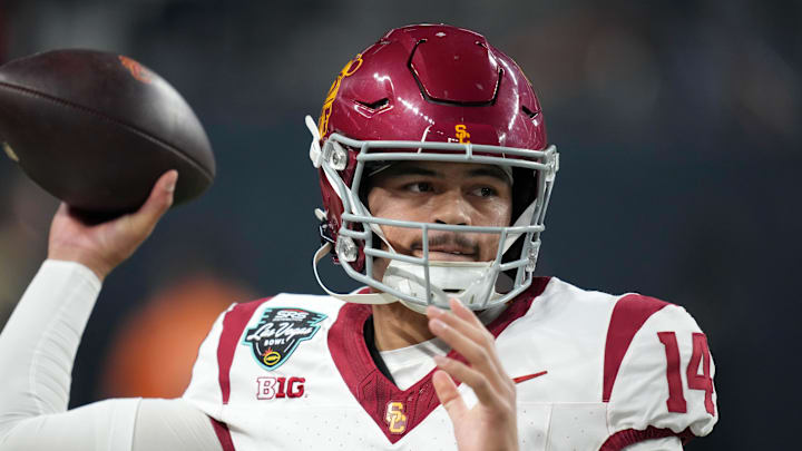 Dec 27, 2024; Las Vegas, NV, USA; Southern California Trojans quarterback Jayden Maiava (14) throws the ball against the Texas A&M Aggies in the first half at Allegiant Stadium. Mandatory Credit: Kirby Lee-Imagn Images