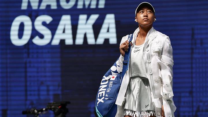 Naomi Osaka steps onto the court in a white dress at the U.S. Open Championships, Billie Jean King National Tennis Center.