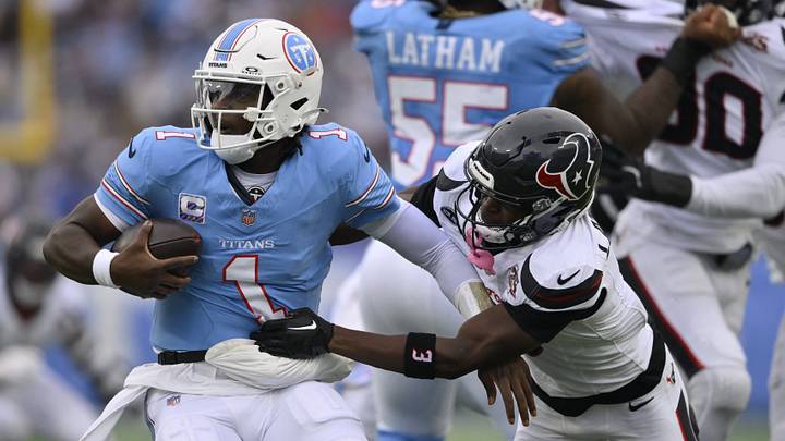 Oct 11, 2026; Nashville, Tennessee, USA; Tennessee Titans quarterback Cam Ward (1) escapes the tackle pf Houston Texans cornerback Kamari Lassiter (3) during the second quarter at Nissan Stadium. Mandatory Credit: Steve Roberts-Imagn Images Oct 11, 2026; Nashville, Tennessee, USA; Tennessee Titans quarterback Cam Ward (1) escapes the tackle pf Houston Texans cornerback Kamari Lassiter (3) during the second quarter at Nissan Stadium. Mandatory Credit: Steve Roberts-Imagn Images