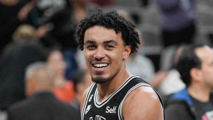 Dec 12, 2022; San Antonio, Texas, USA; San Antonio Spurs guard Tre Jones (33) smiles after the team s win over the Cleveland Cavaliers at the AT&T Center. Mandatory Credit: Daniel Dunn-Imagn Images