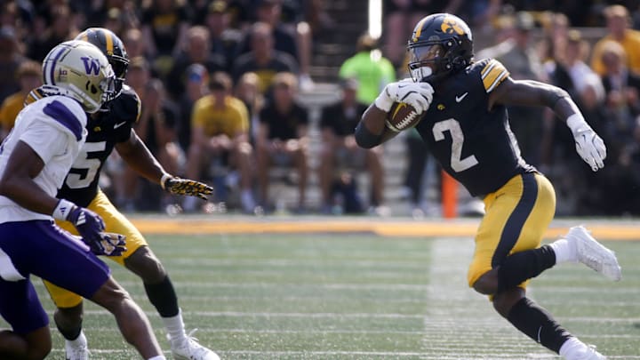 Iowa’s Kaleb Johnson (2) runs the ball against Washington Saturday, Oct. 12, 2024 at Kinnick Stadium in Iowa City, Iowa.