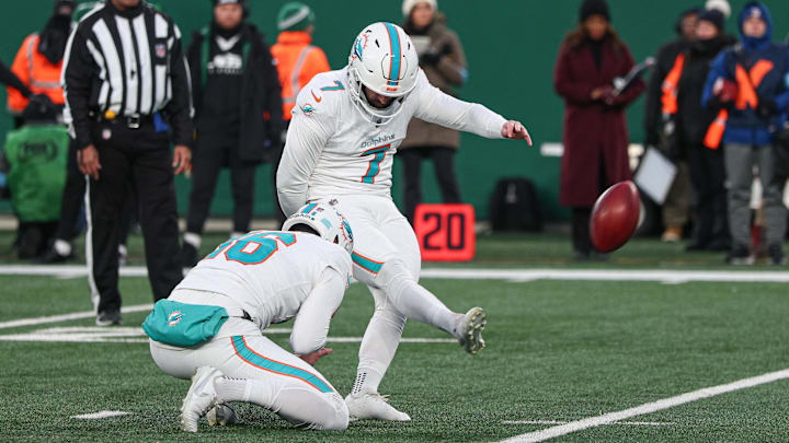 Miami Dolphins place kicker Jason Sanders (7) kicks a field goal as punter Jake Bailey (16) holds during the first quarter against the New York Jets at MetLife Stadium in Week 18 of the 2024 season.