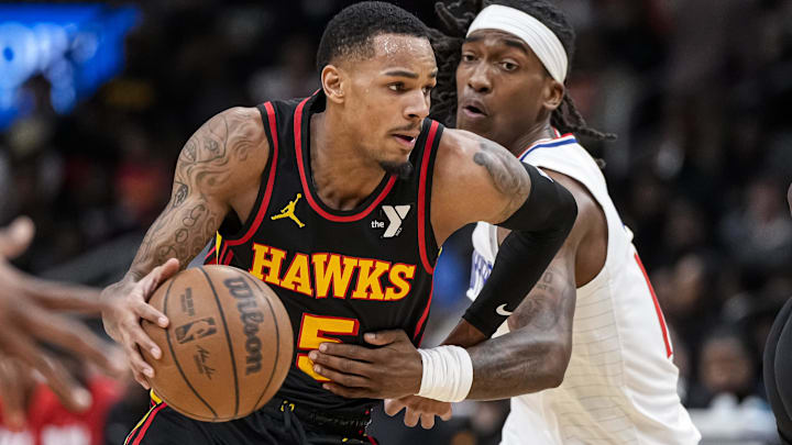 Feb 5, 2024; Atlanta, Georgia, USA; Atlanta Hawks guard Dejounte Murray (5) dribbles past LA