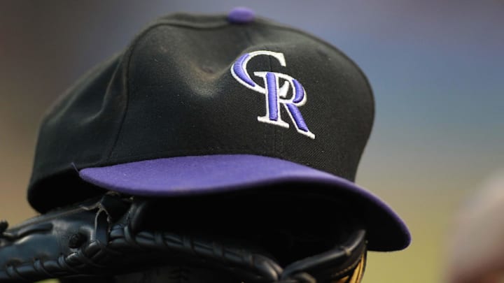 Jun 24, 2012; Arlington, TX, USA; Colorado Rockies hat and glove in the dugout during the game against the Texas Rangers at Rangers Ballpark. The Rangers beat the Rockies 4-2. Jun 24, 2012; Arlington, TX, USA; Colorado Rockies hat and glove in the dugout during the game against the Texas Rangers at Rangers Ballpark. The Rangers beat the Rockies 4-2.